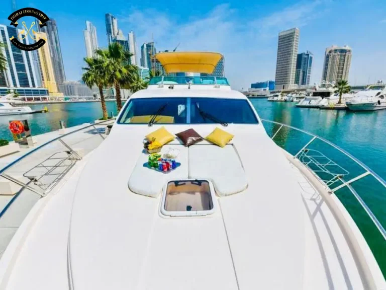 Dubai Fishing Trip. Elite 12 Majesty 56 FT sunbed in front of the boat.