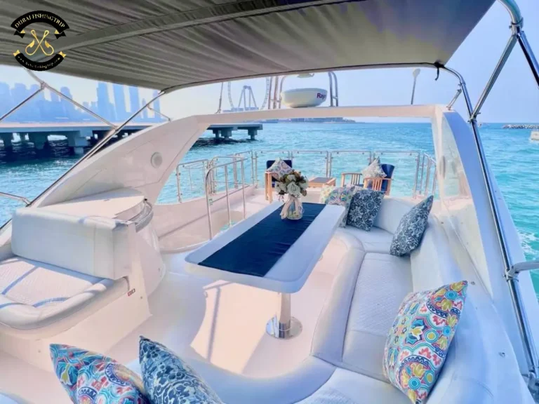 Dubai Fishing Trip. Elite 12 Majesty 56 FT upper deck with pillows, table and seats.